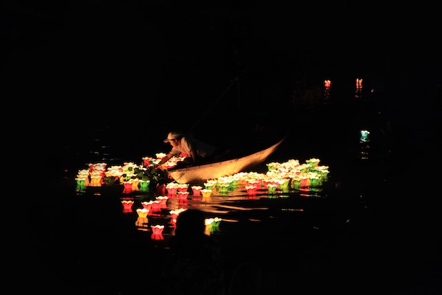 man riding on boat with lights