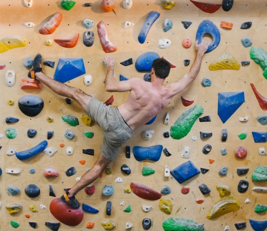 World Practice of Insurance for Athletes person doing rock climbing