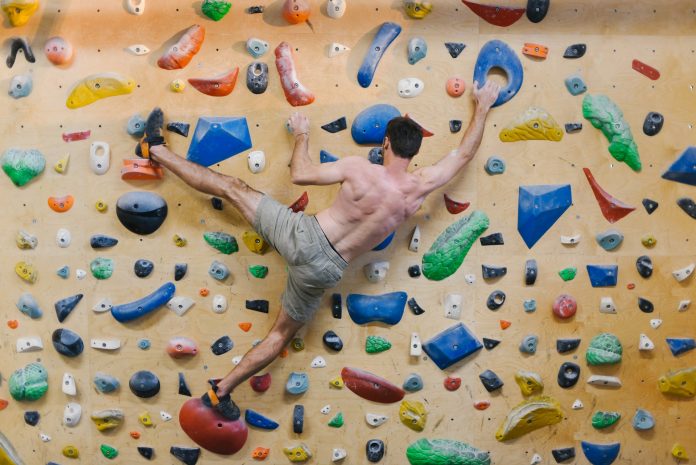 person doing rock climbing