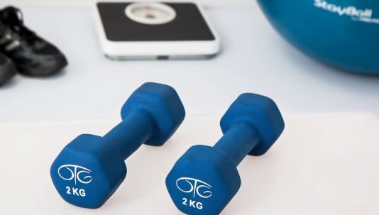 Creating Your Perfect Home Gym: a Comprehensive Guide Home Gym - Two 2 Kg. Blue Hex Dumbbells on White Surface