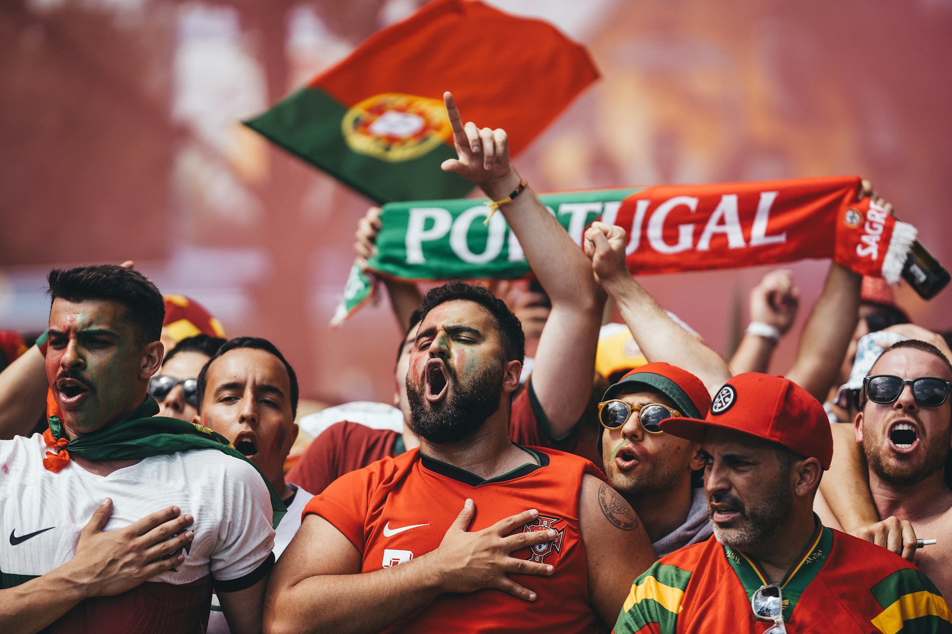a-group-of-people-holding-up-signs-and-flags