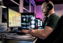 Guide to the 10 Best Gaming Blogs for Lore a-man-sitting-in-front-of-a-computer-with-headphones