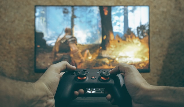 hands-holding-a-game-controller-playing-a-video-game